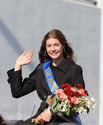  Photo of Harvest of Harmony pageant first runner up Samantha Gearhart waving in a car during parade